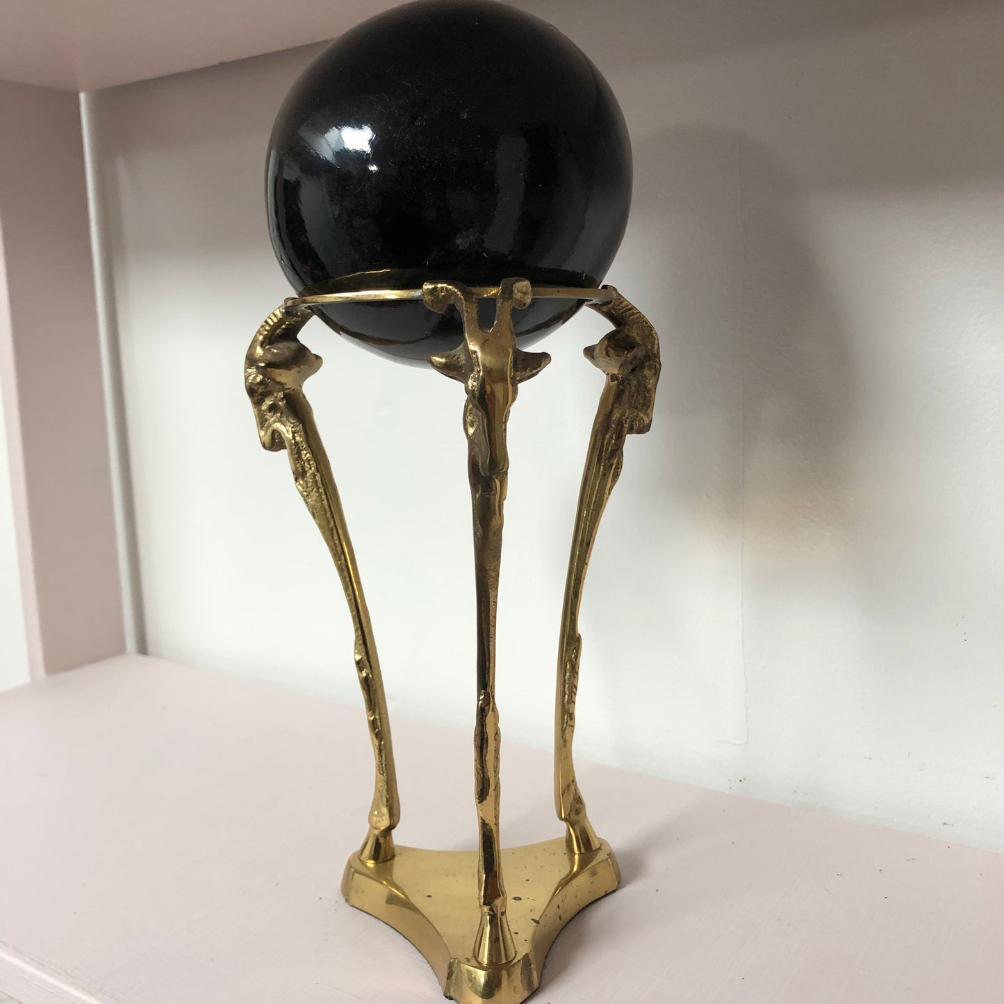 Brass Ram with Black Globe sculpture