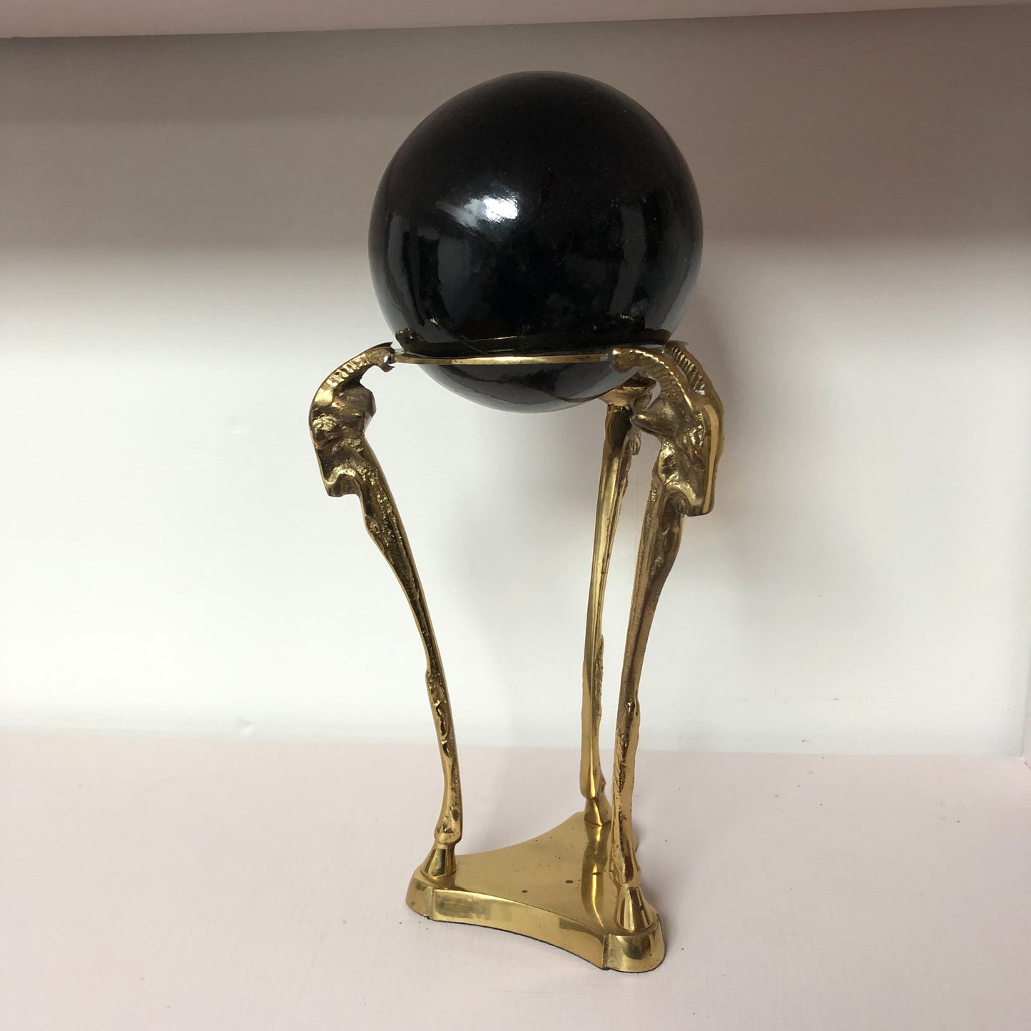 Brass Ram with Black Globe sculpture