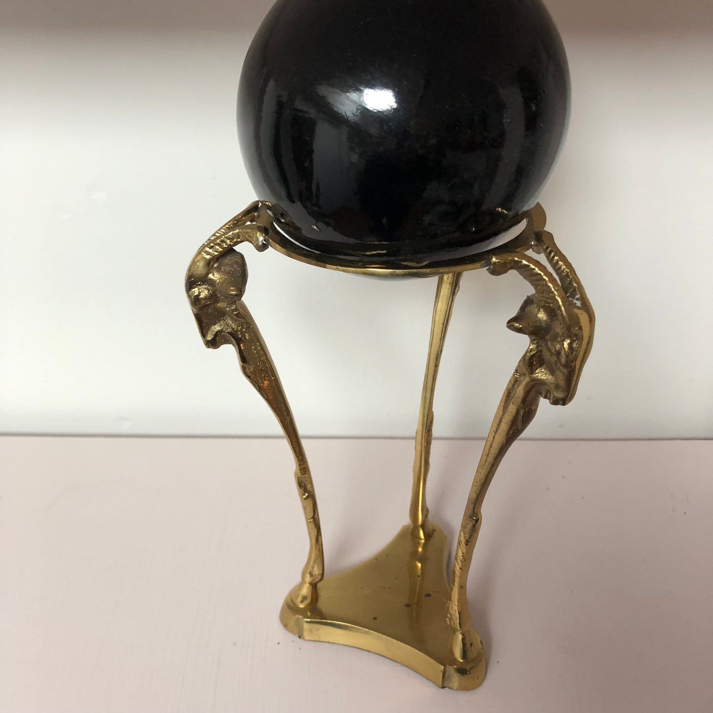 Brass Ram with Black Globe sculpture