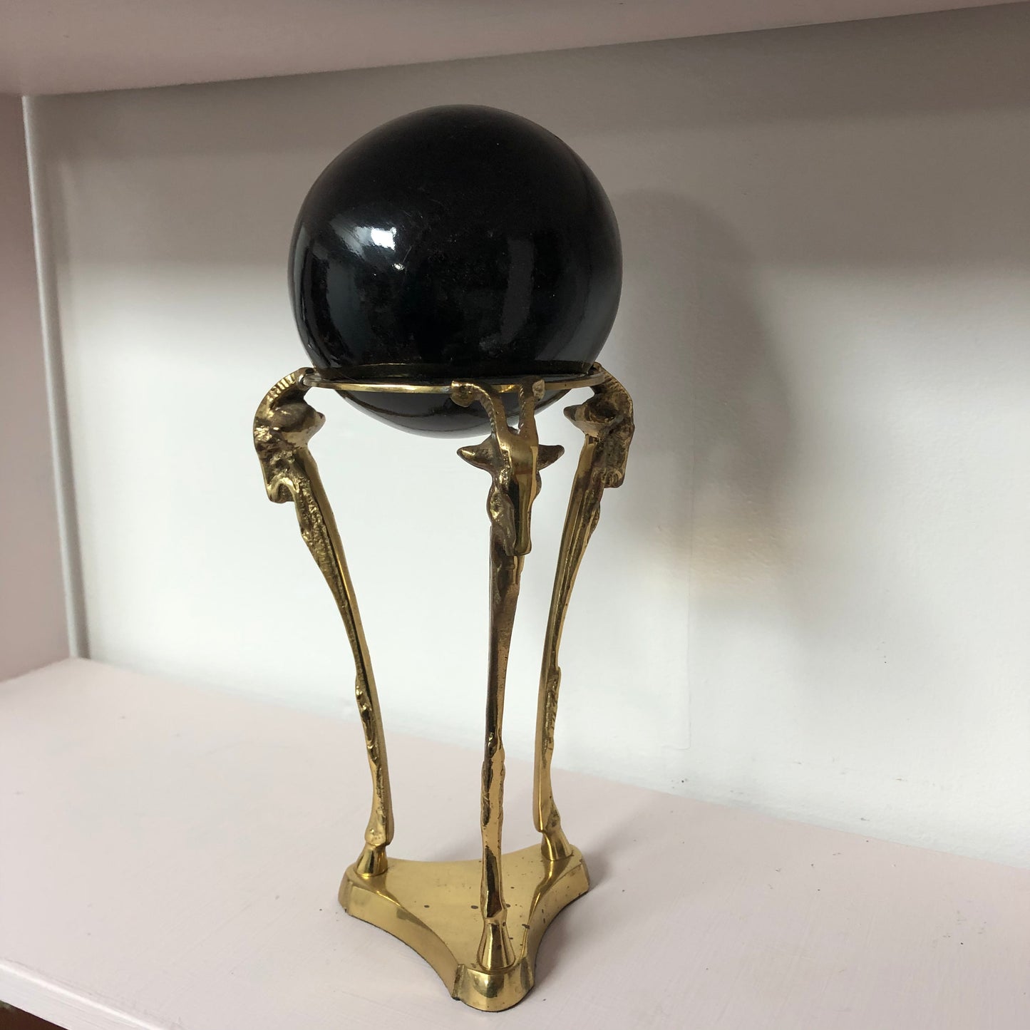 Brass Ram with Black Globe sculpture