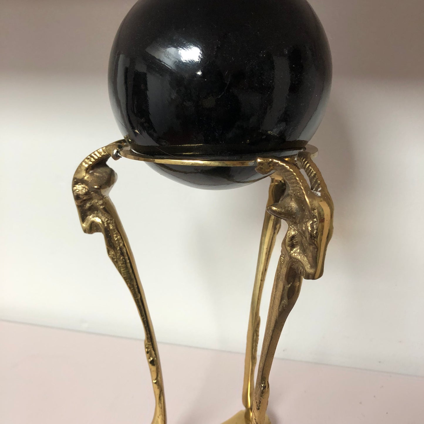 Brass Ram with Black Globe sculpture